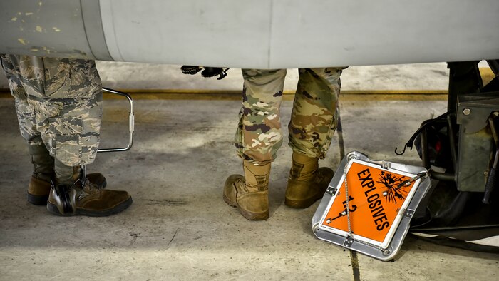 A photo of Airmen performing maintenance on aircraft.