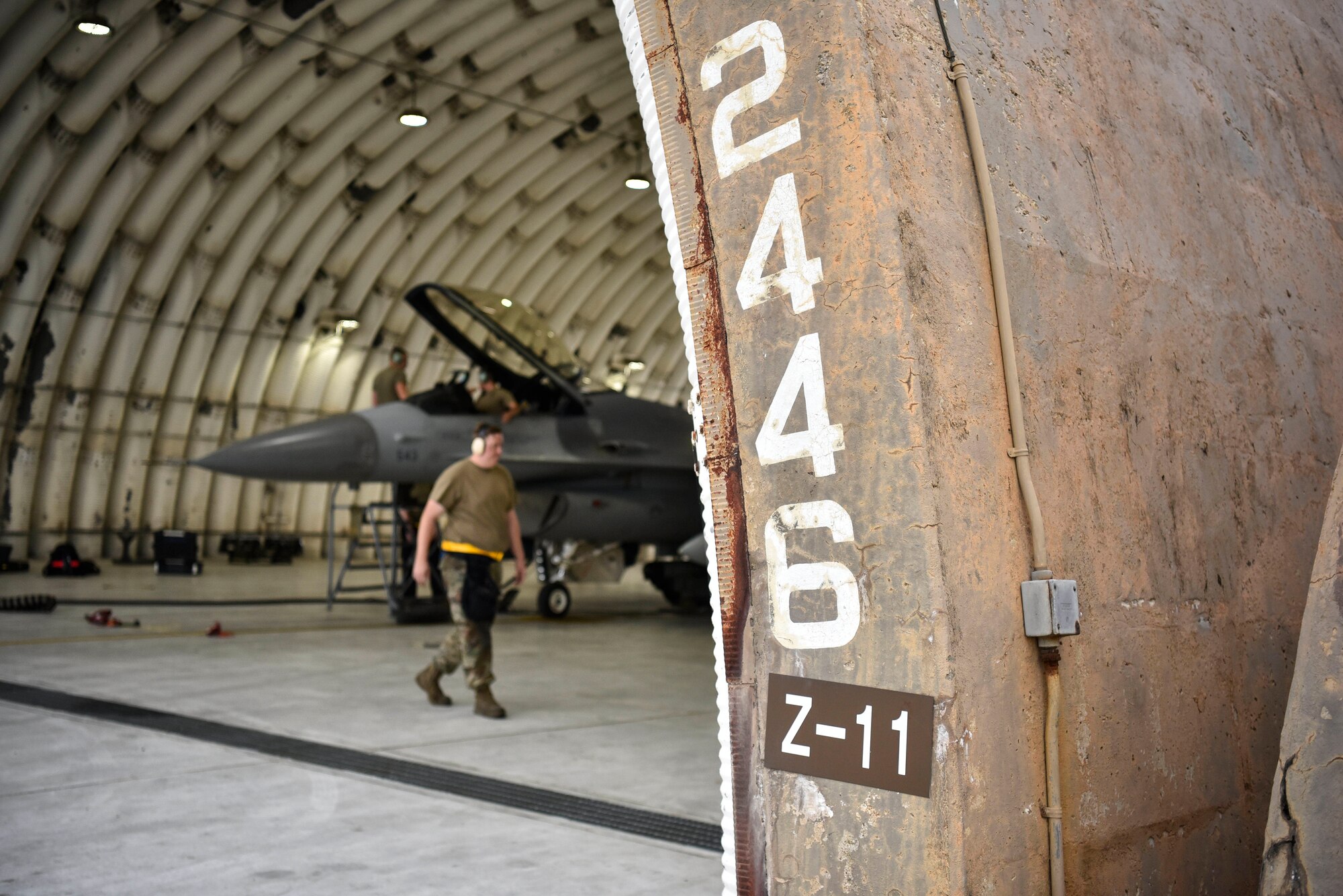 A photo of Airmen doing maintenance on aircraft.