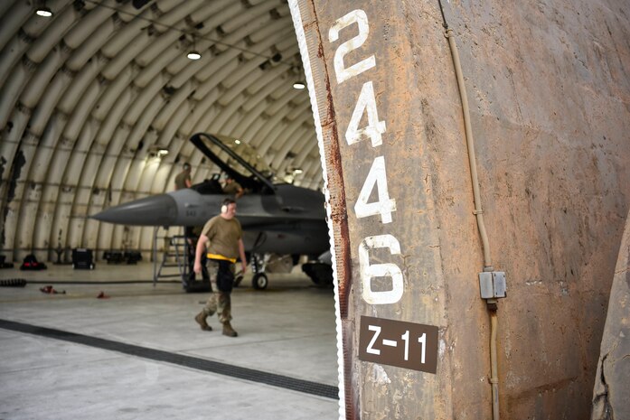 A photo of Airmen doing maintenance on aircraft.