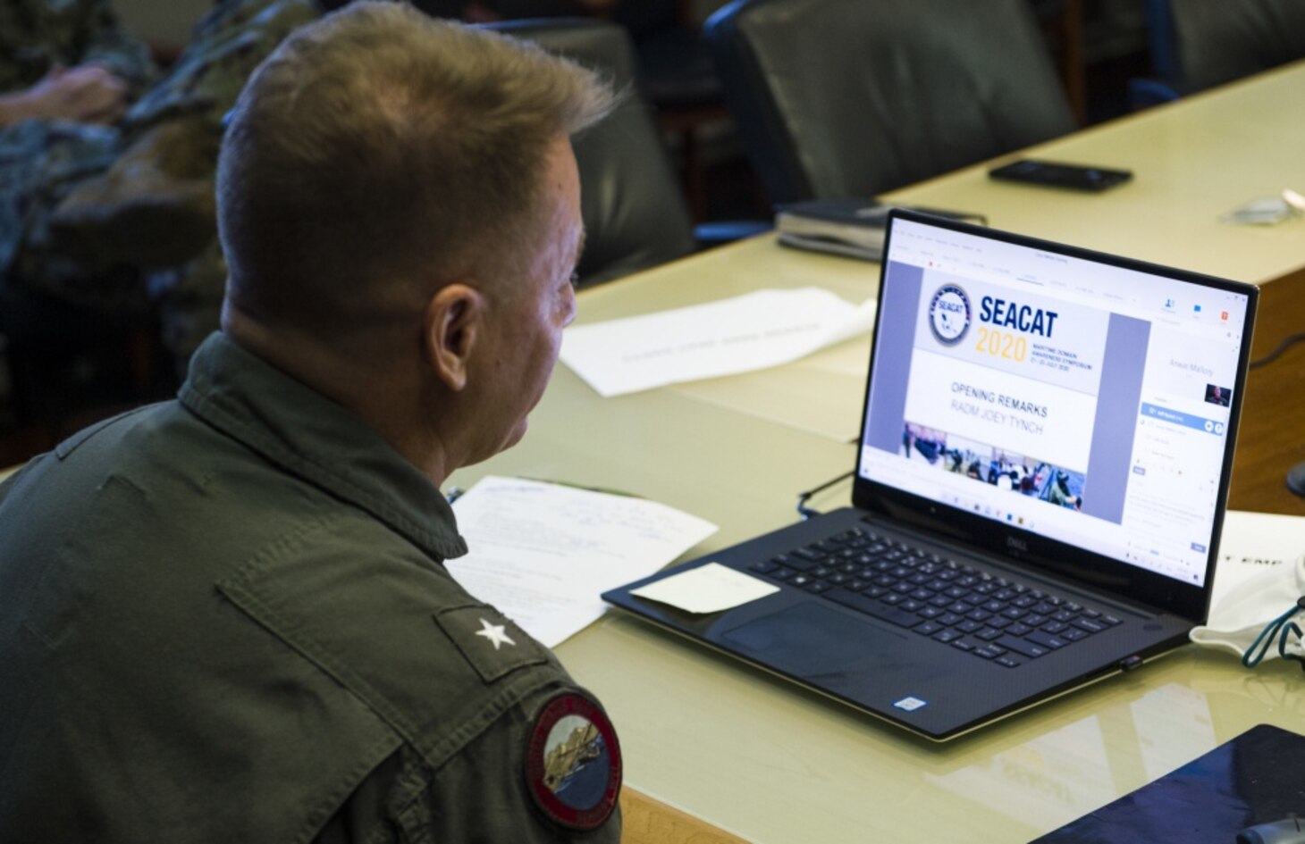 SINGAPORE (July 21, 2020) Rear Adm. Joey Tynch, commander, Logistics Group Western Pacific, provides his opening remarks to virtual participants in support of Southeast Asia Cooperation and Training (SEACAT) 2020. SEACAT promotes shared commitments to maritime partnerships, security and stability in Southeast Asia. This year, SEACAT takes shape as a virtual maritime domain awareness symposium with representatives from 22 participating nations.
