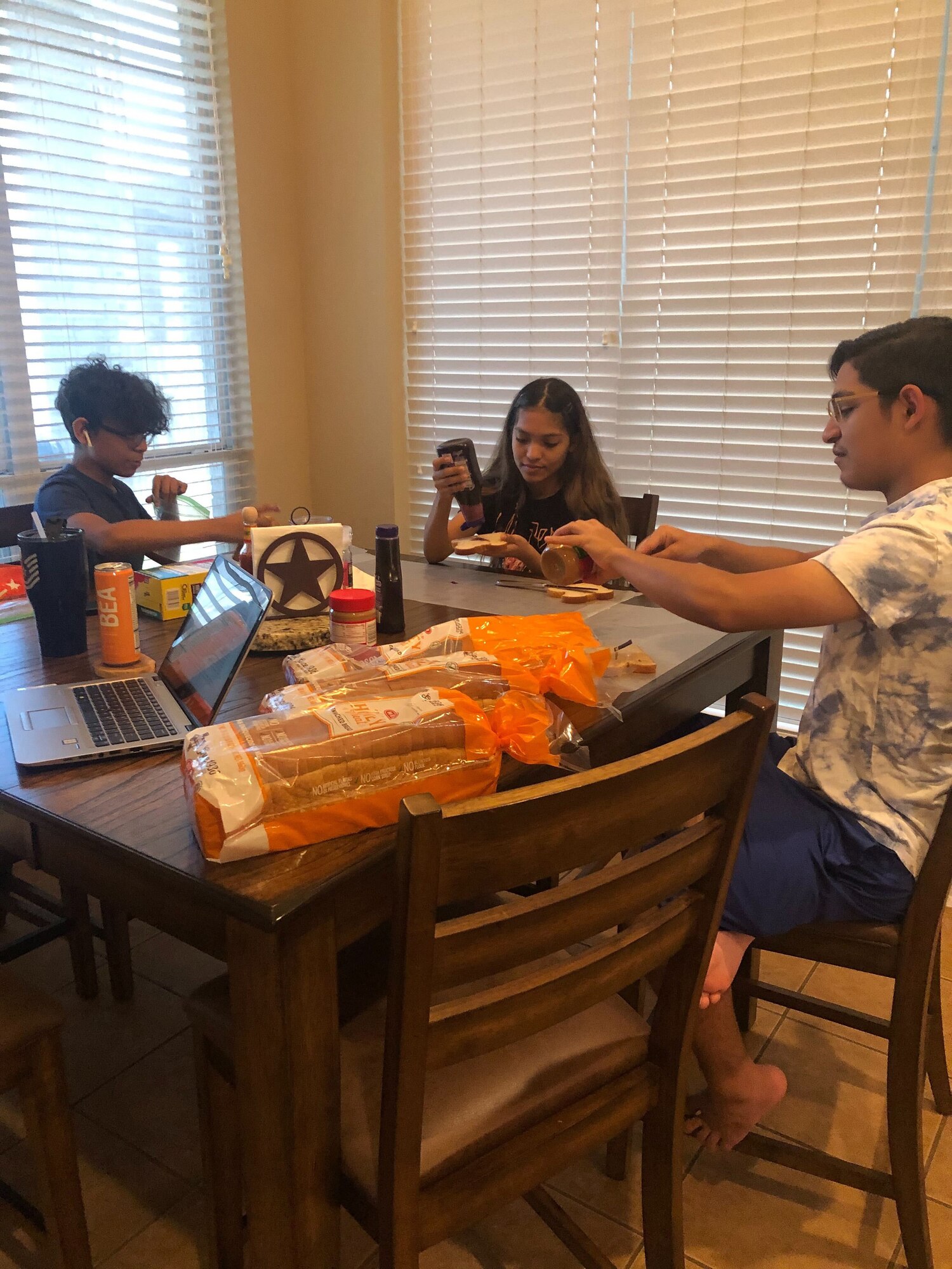 The Lamar family pitches in to make peanut butter and jelly sandwiches for those in need in the local area. Reserve Citizen Airmen from the 23rd Intelligence Squadron donated more than 1,000 peanut butter and jelly sandwiches in the last month to local San Antonians in need.