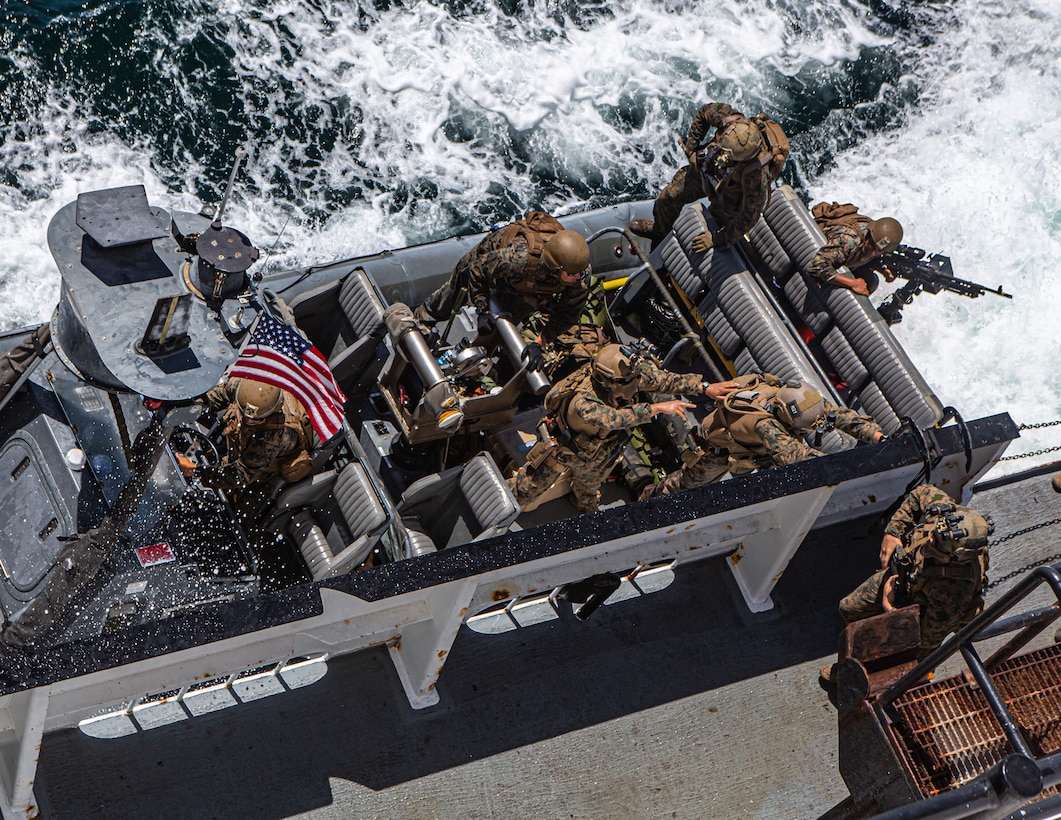 U.S. Marines climb a caving ladder during a visit, board, search and seizure exercise off the coast of Marine Corps Base Camp Pendleton, Calif., July 15.