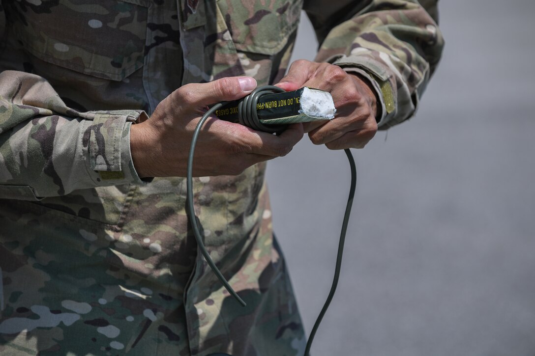 Senior Airman Tron Le, 31st Civil Engineer Squadron explosive ordnance disposal technician prepares a block of C4 for training purposes at Aviano Air Base, Italy, July 15, 2020. EOD members are the specialists who serve as the Air Force’s bomb squad and are trained to detect, disarm, detonate and dispose of explosive threats all over the world. EOD Airmen apply learned techniques and special procedures to lessen or totally remove the hazards created by the presence of unexploded ordnance. (U.S. Air Force photo by Airman 1st Class Thomas S. Keisler IV)