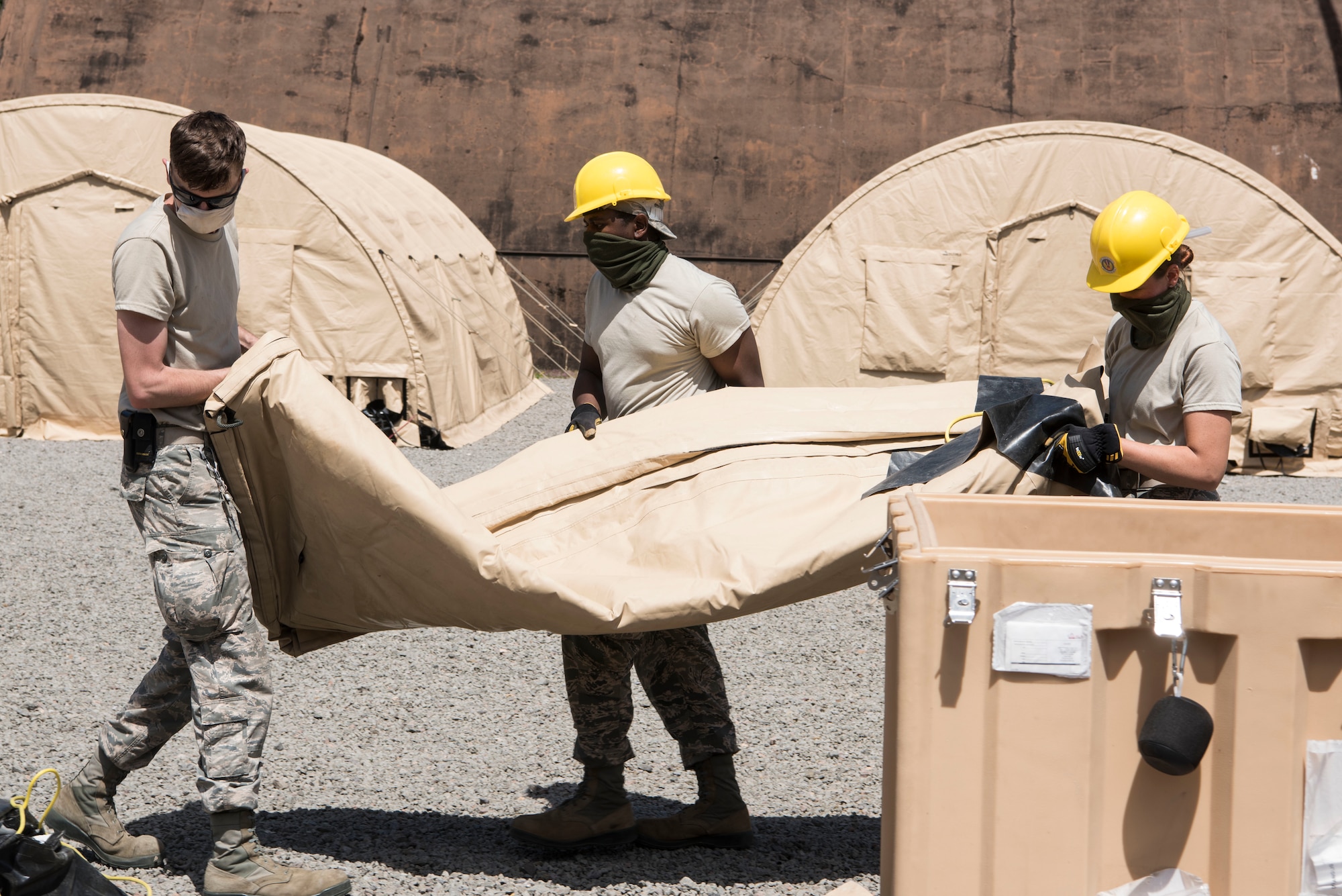 U.S. Air Force Airmen move tent materials during Silver Flag.