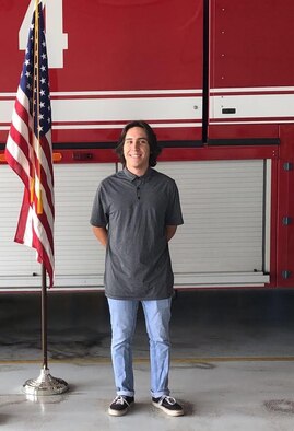 Connor Tabarini stands in front of a fire engine at the Idaho Air National Guard’s Gowen Field, after enlisting as a fireman in the Air Force Reserve.