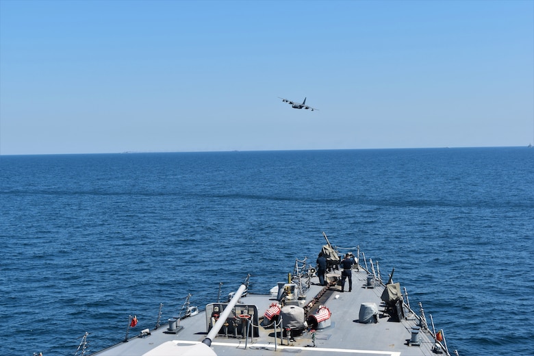 Military aircraft and ship in the Black Sea.