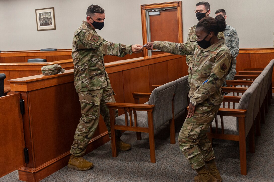 Photo of an Airman receiving a coin
