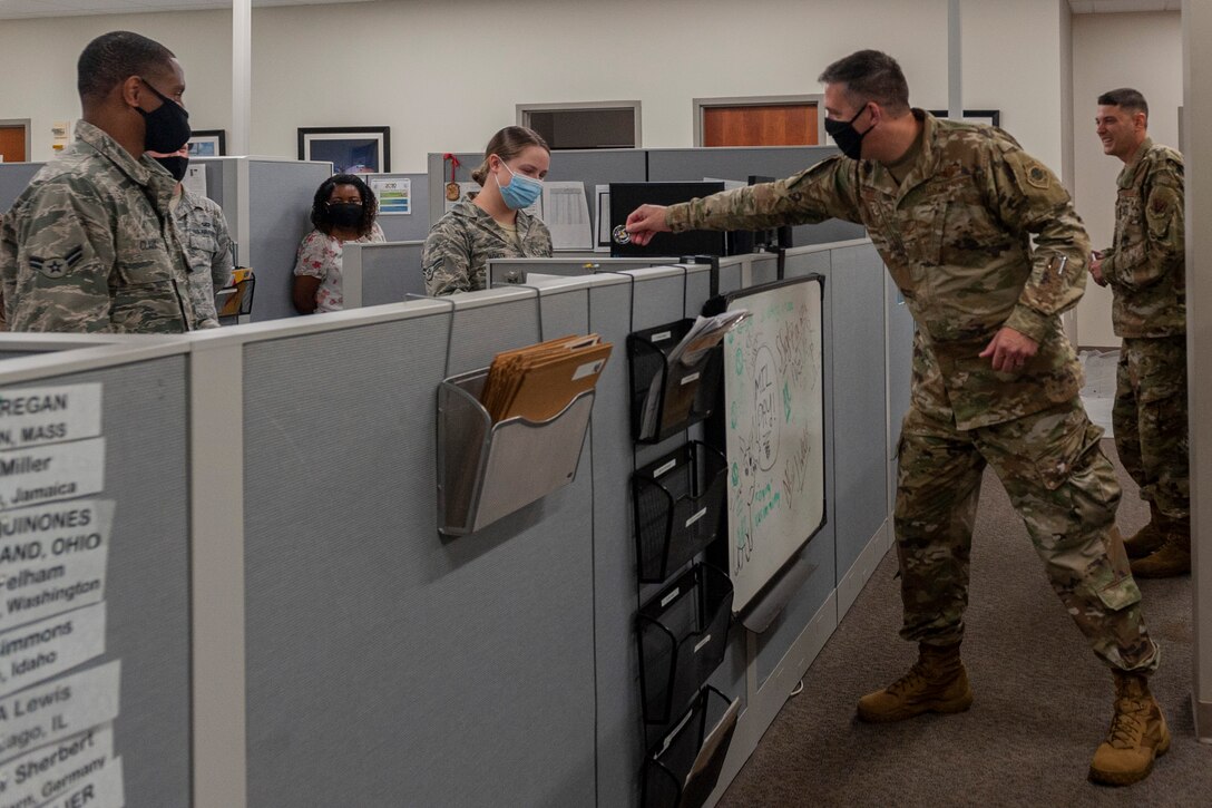 Photo of an Airman receiving a coin