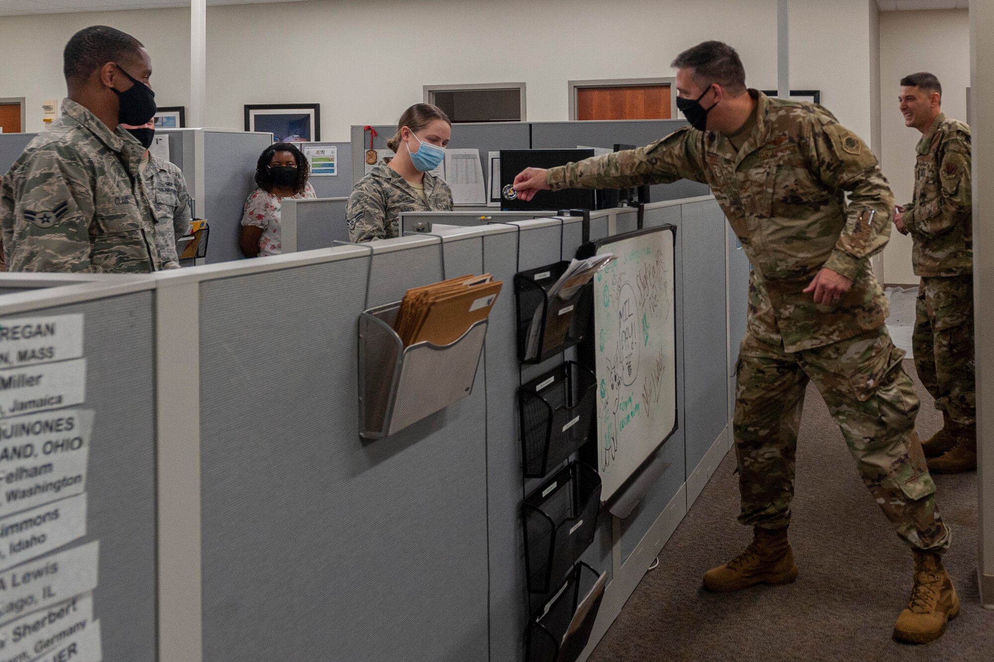 Photo of an Airman receiving a coin