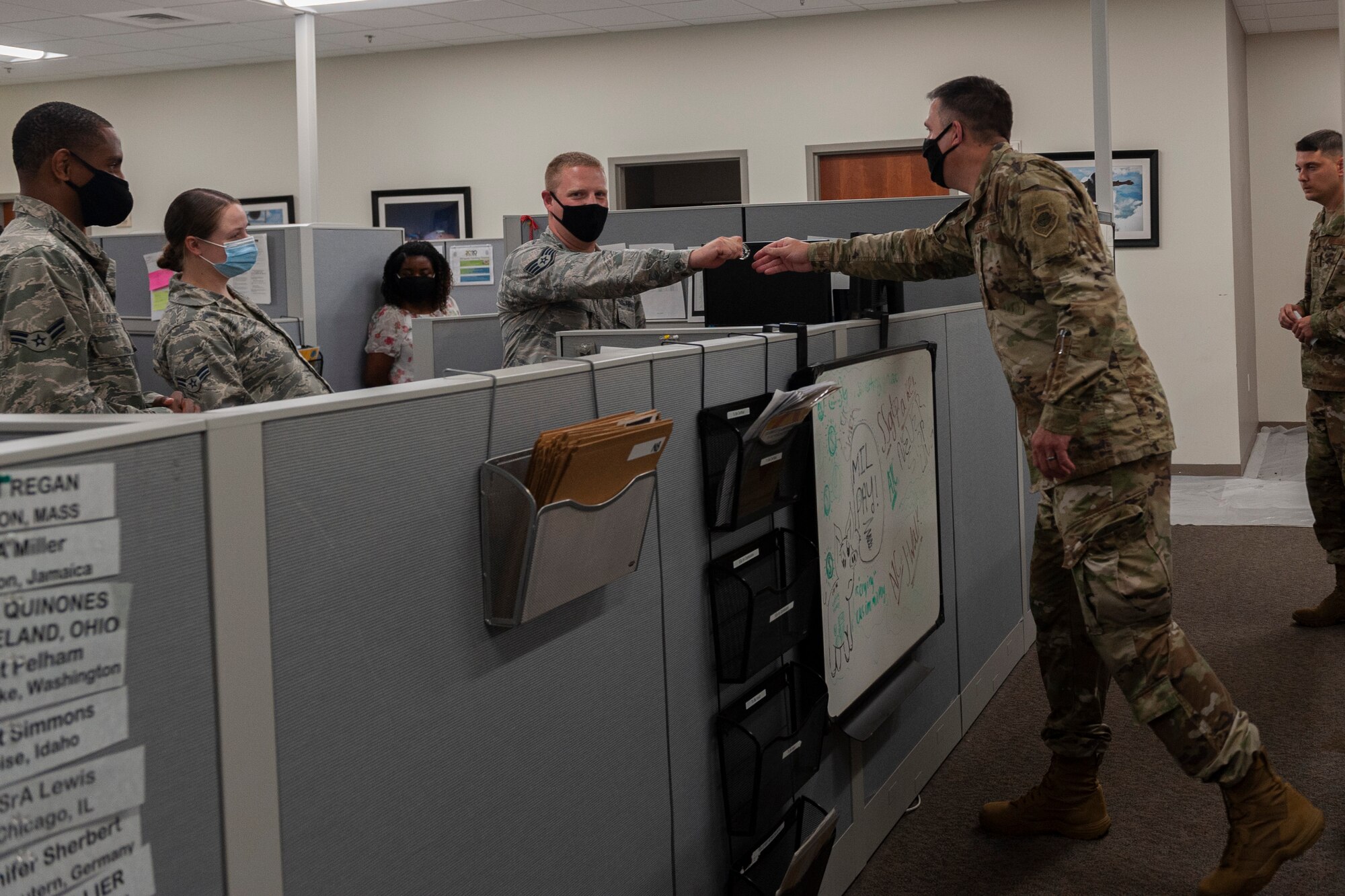 Photo of an Airman receiving a coin
