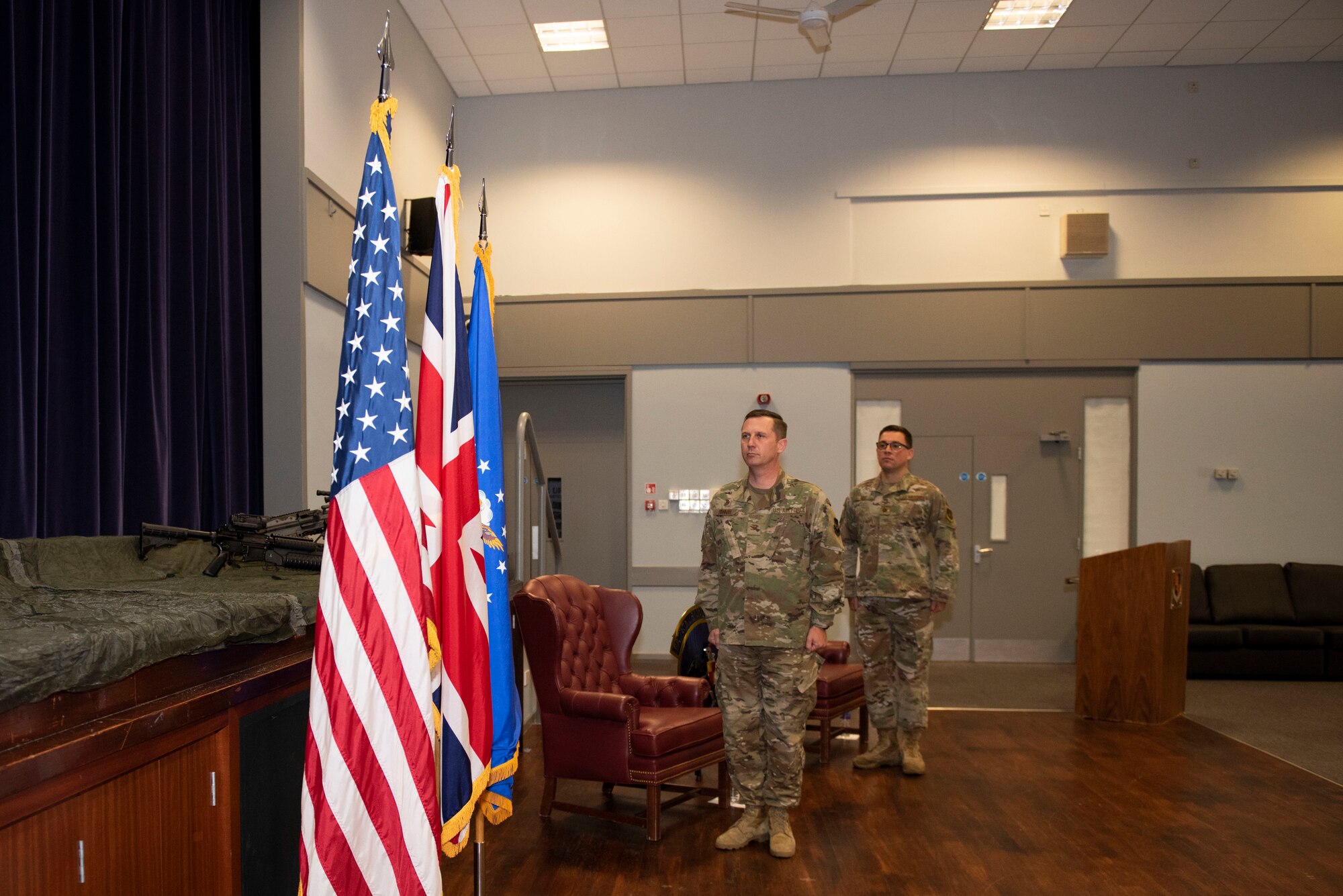 U.S. Air Force Col. Jon Hannah, left, 422nd Air Base Group commander, and Maj. Thomas Uhl, right, 422nd Security Forces Squadron (SFS) incoming commander, stand at attention for the playing of the national anthem during the 422nd SFS Assumption of Command ceremony at RAF Croughton, England, July 22, 2020. The change of command ceremony is rooted in military history dating back to the 18th century representing the relinquishing of power from one officer to another. (U.S. Air Force photo by Airman 1st Class Jennifer Zima)