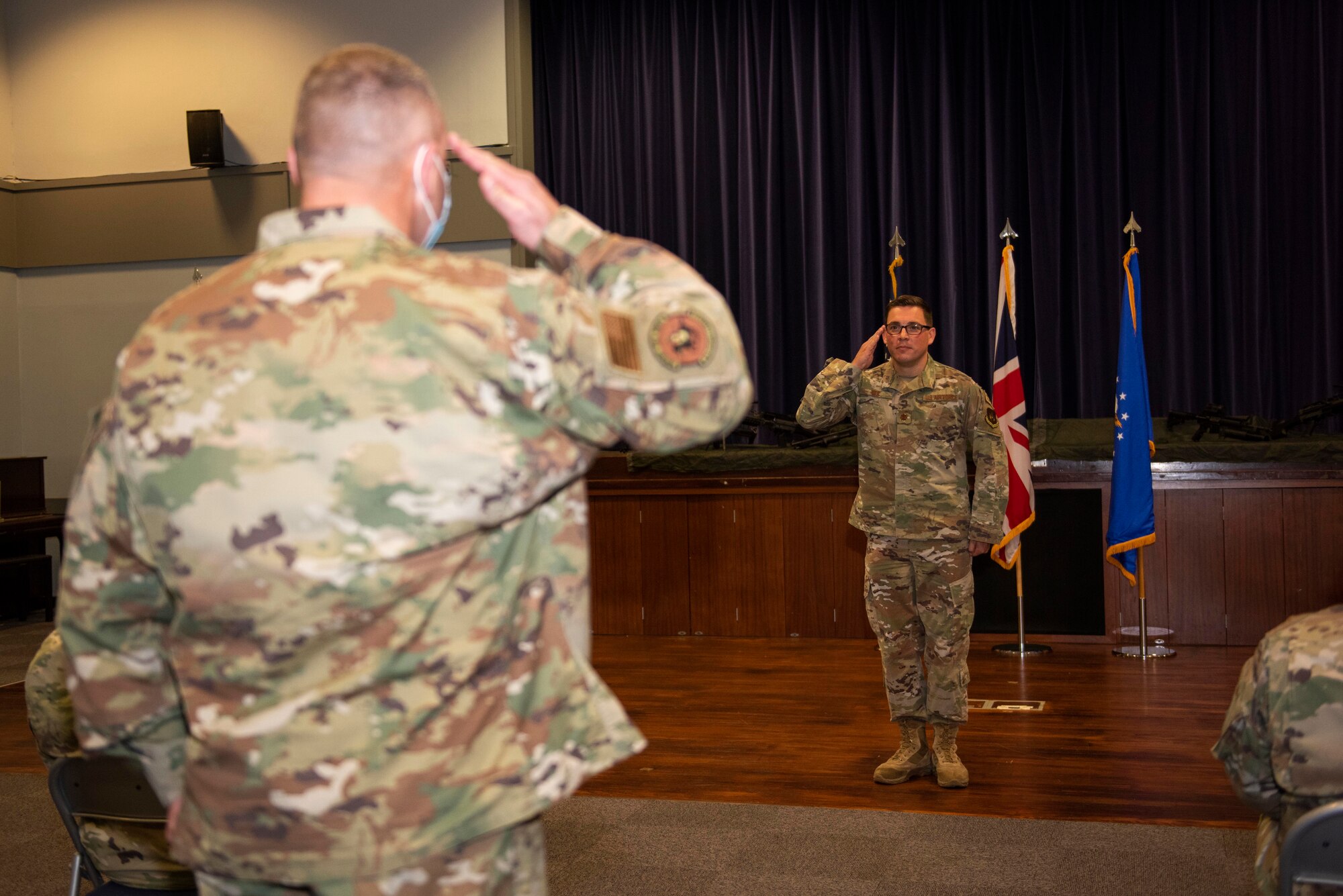 U.S. Air Force Maj. Thomas Uhl, 422nd Security Forces Squadron (SFS) incoming commander, receives his first salute as a commander during the 422nd SFS Assumption of Command ceremony at RAF Croughton, England, July 22, 2020. The change of command ceremony is rooted in military history dating back to the 18th century representing the relinquishing of power from one officer to another. (U.S. Air Force photo by Airman 1st Class Jennifer Zima)