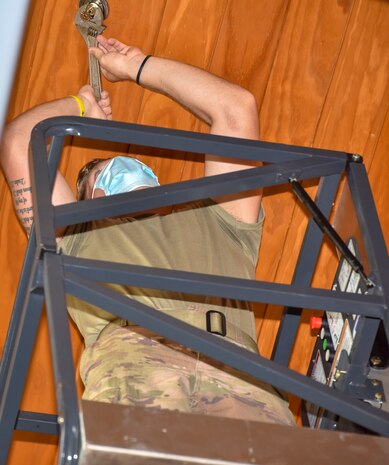 Senior Airman Logan Smith, a water and fuel system maintenance journeyman assigned to the 628th Civil Engineer Squadron, checks for a leak on a sprinkler head for a restored fire suppression system inside the dining facility at Joint Base Charleston, S.C., July 15, 2020. Members of the 628th CES/ WFSM work to support and maintain the water systems needed to keep the mission going and maintain readiness.