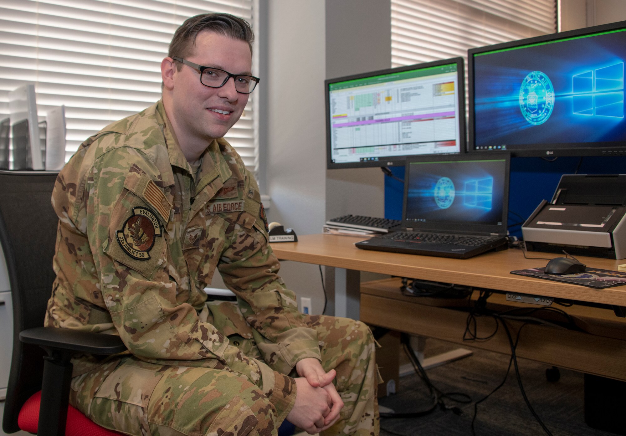 U.S. Air Force Staff Sgt. Kevin Robinson, 22nd Airlift Squadron evaluator loadmaster, sits at a computer workstation used to aircrew using virtual reality technology July 21, 2020, at Travis Air Force Base, California. Robinson is the 60th Air Mobility Wing Warrior of the Week for June 14-20, 2020.  The program recognizes outstanding Airmen who have made significant contributions to their unit. (U.S. Air Force photo by Heide Couch)