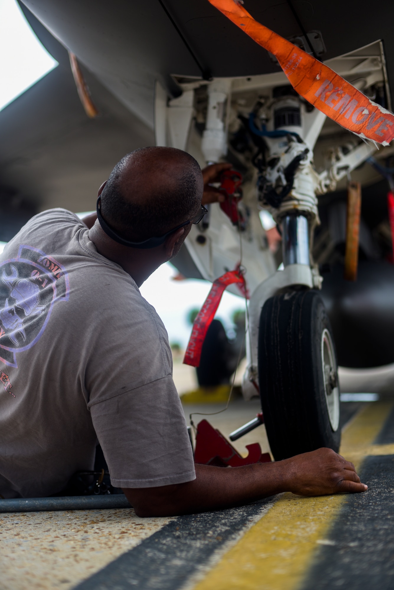 Dan Jones with the 82nd Aerial Targets Squadron, contractor, performs maintenance to the front gear of a QF-16 at Tyndall Air Force Base, Florida, July 9, 2020. Operations and performance checks are completed before and after every aircraft take off. (U.S. Air Force Staff Sgt. Magen M. Reeves)