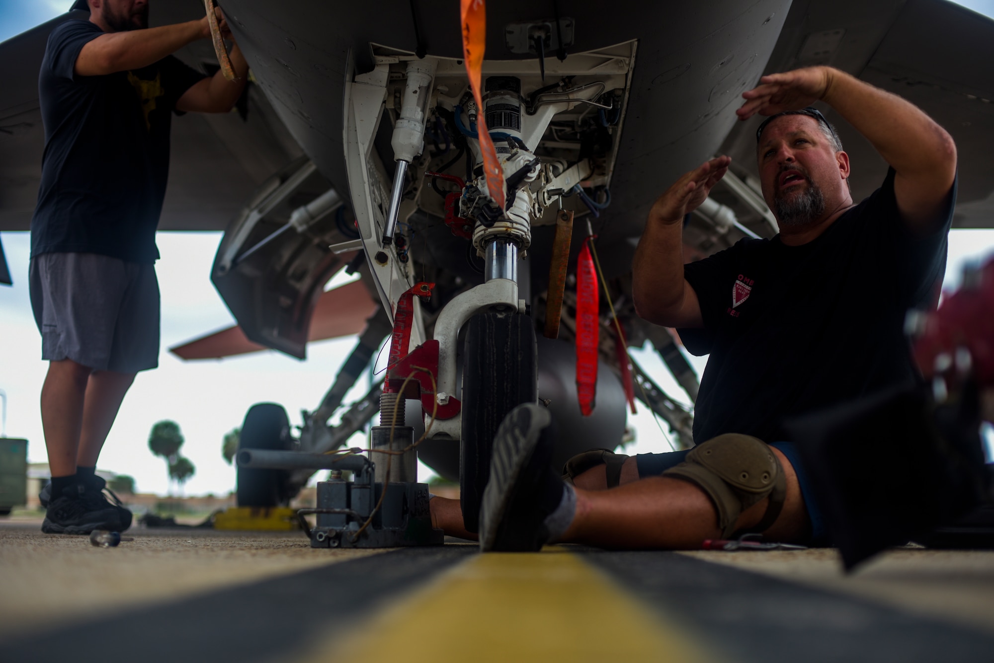 Michael Reeves with the 82nd Aerial Targets Squadron, contractor, works to replace the front landing tire on a QF-16 at Tyndall Air Force Base, Florida, July 9, 2020. The 82nd ARTS contractors fulfill a variety of different flight line technical skills, including replacing old or malfunctioning landing gear. (U.S. Air Force photo by Staff Sgt. Magen M. Reeves)