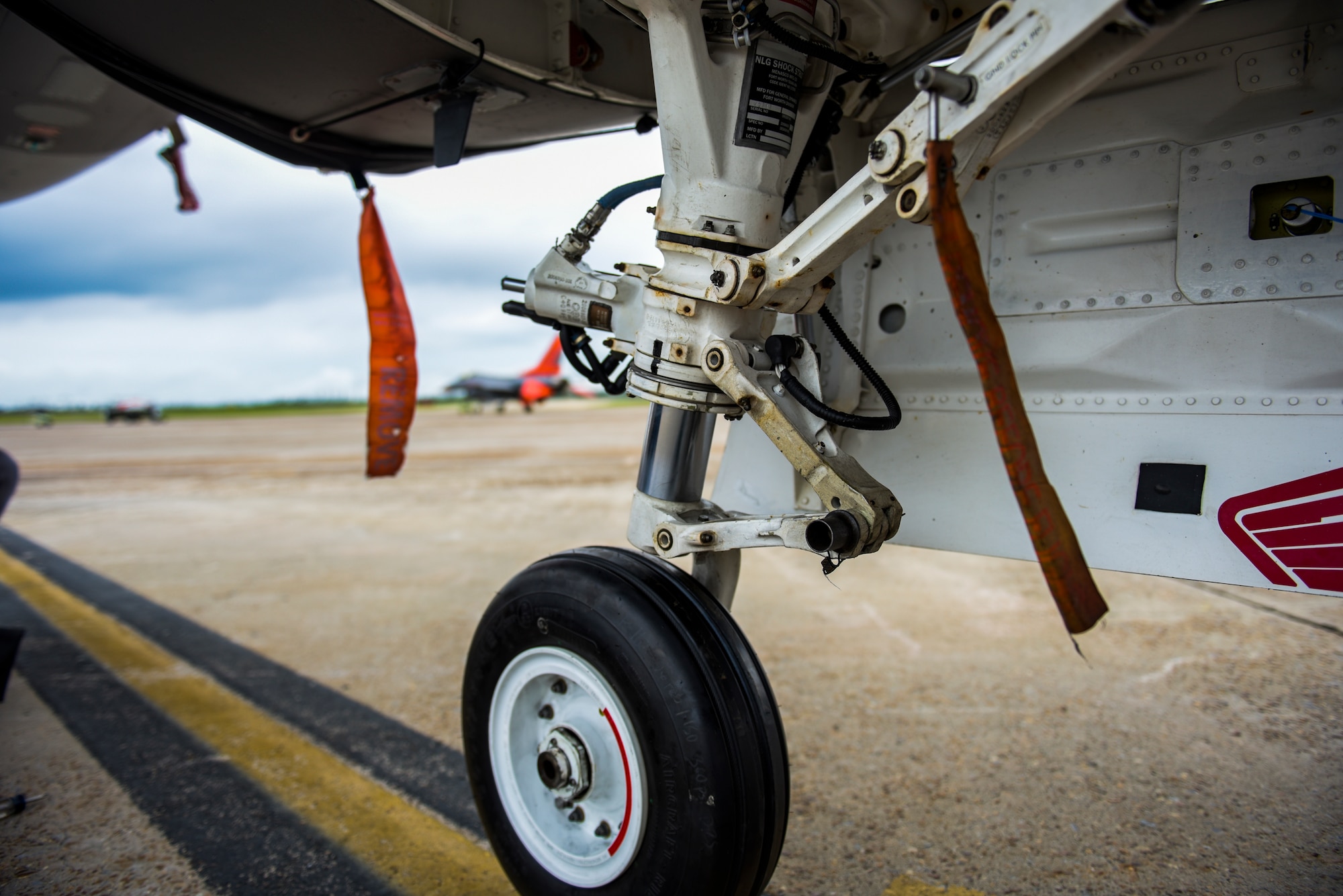 Pictured is the front landing tire of an QF-16 at Tyndall Air Force Base, Florida, July 9, 2020. The QF-16 aircraft directly supports fourth-generation fighter capabilities in the aerial target mission set, by allowing the aircraft to be both manned or remotely piloted. (U.S. Air Force photo by Staff Sgt. Magen M. Reeves)