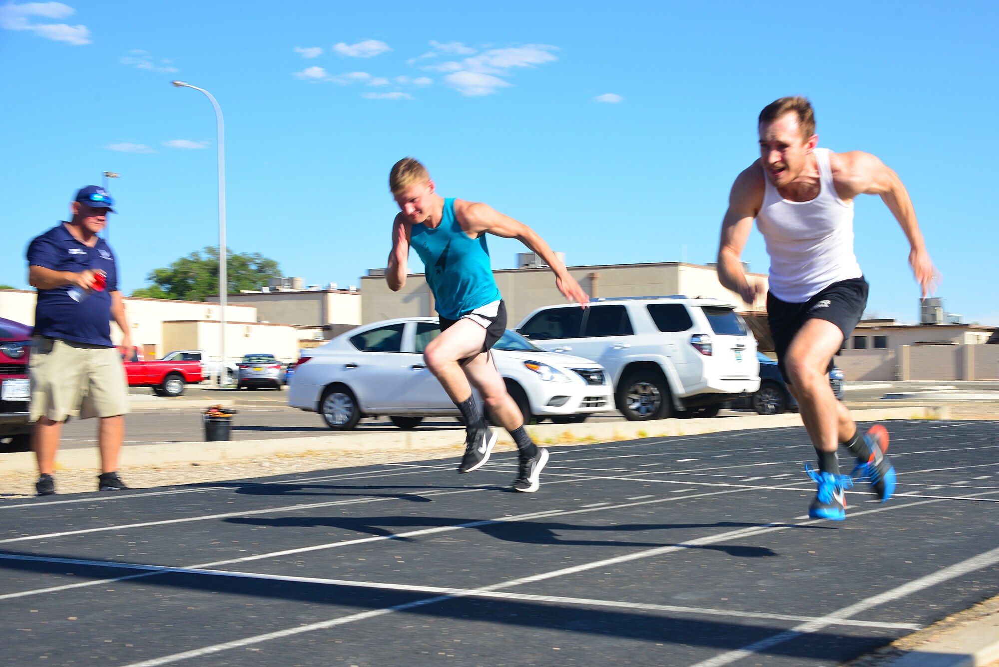 Airmen run on a track.