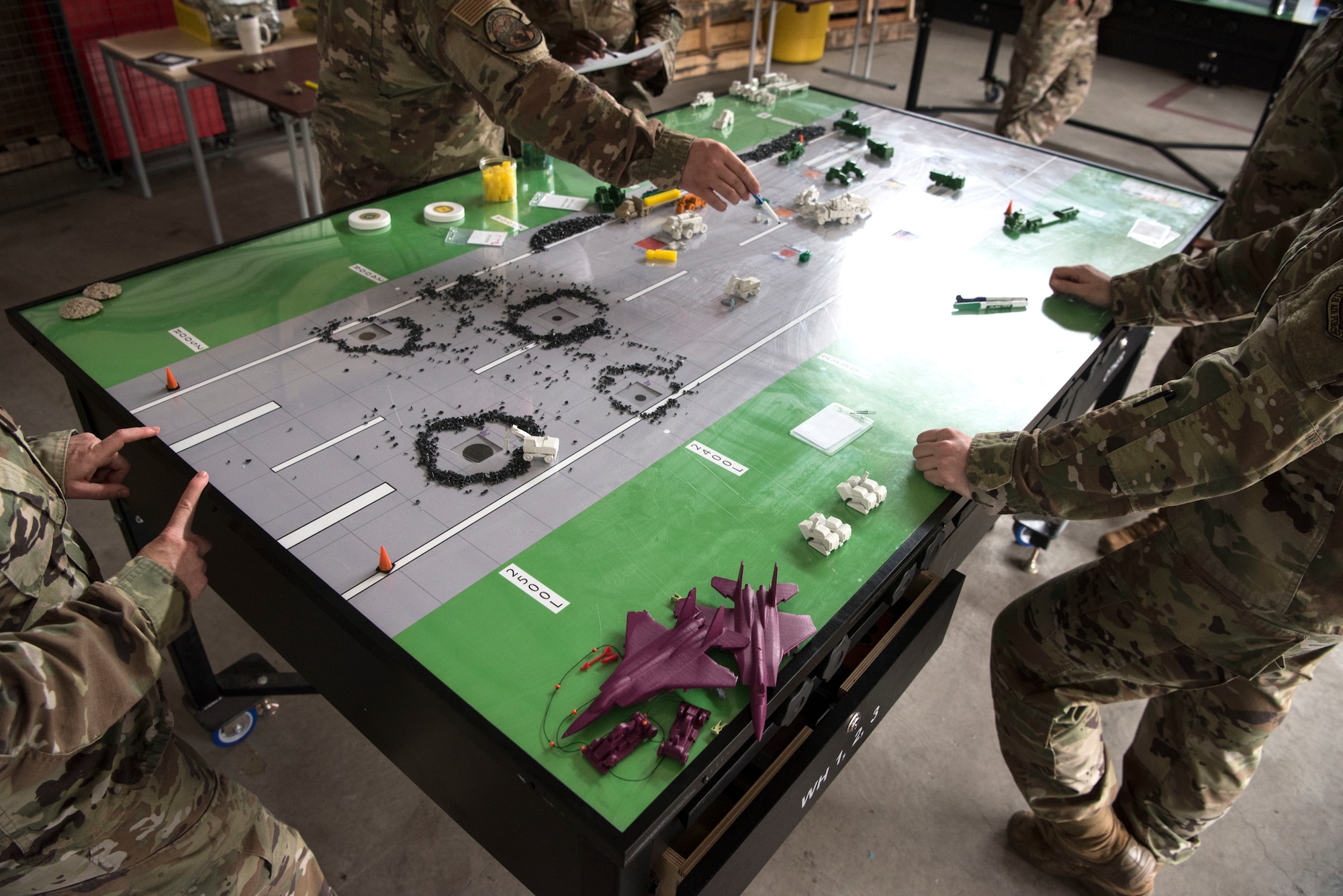 U.S. Air Force Airmen participate in a table top demonstration during Silver Flag