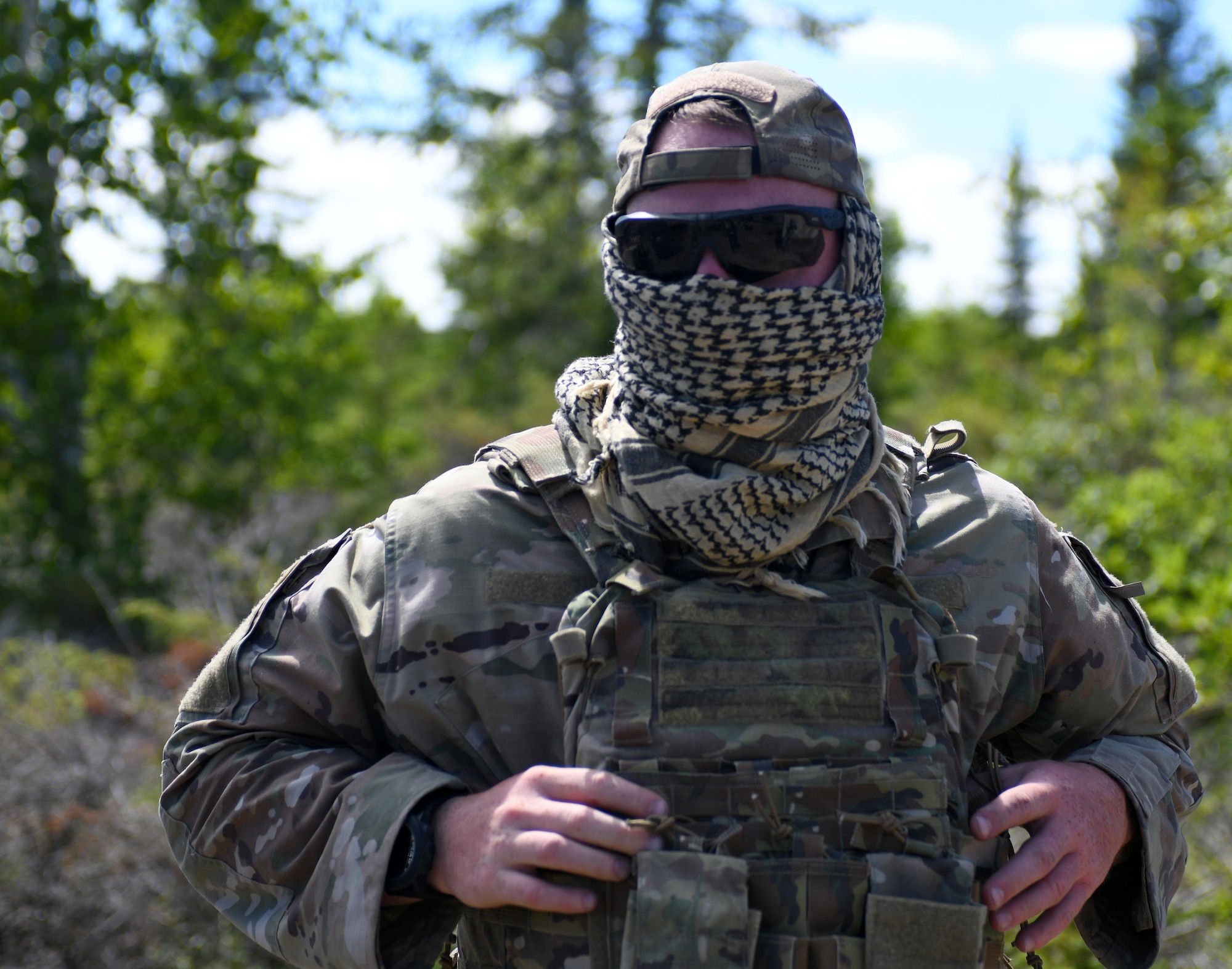 A 164th Security Forces Squadron defender puts on gear while serving as a member of the opposition forces during Northern Strike 20 in Rogers City, Mich., July 21, 2020. The 164th SFS acted as the opposition force for other participants of Northern Strike.