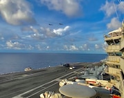 U.S. Air Force B-1B Lancers fly by the USS Ronald Reagan Carrier Strike Group in the Philippine Sea during a Bomber Task Force mission, July 21, 2020. Strategic bomber missions contribute to the joint lethality and readiness of the U.S. Air Force and its allies and partners throughout the Indo-Pacific region. (Courtesy Photo by U.S. Navy)