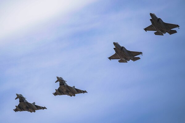 Four aircraft fly in formation.