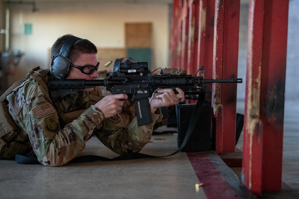 U.S. Air Force Capt. Gregory Speirs, 621st Contingency Response Wing judge advocate, fires the M-4 Rifle May 27, 2020, during an M-4 Rifle/Carbine Air Force qualification course at Travis Air Force Base, California. Speirs completed the course at the 60th Security Forces Squadron combat arms training and maintenance range. The CATM section trains Airmen on 10 weapon systems each year. (U.S. Air Force photo by Tech. Sgt. James Hodgman)
