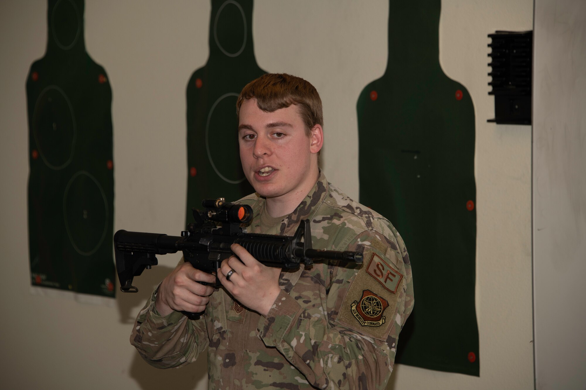 U.S. Air Force Staff Sgt. Frank Joseph, 60th Security Forces Squadron combat arms training and maintenance instructor, teaches Airmen how to handle an M-4 carbine rifle during a class at Travis Air Force Base, California, May 27, 2020. Joseph is part of a nine-member CATM team at Travis AFB who trains more than 3,000 Airmen annually. (U.S. Air Force photo by Tech. Sgt. James Hodgman)