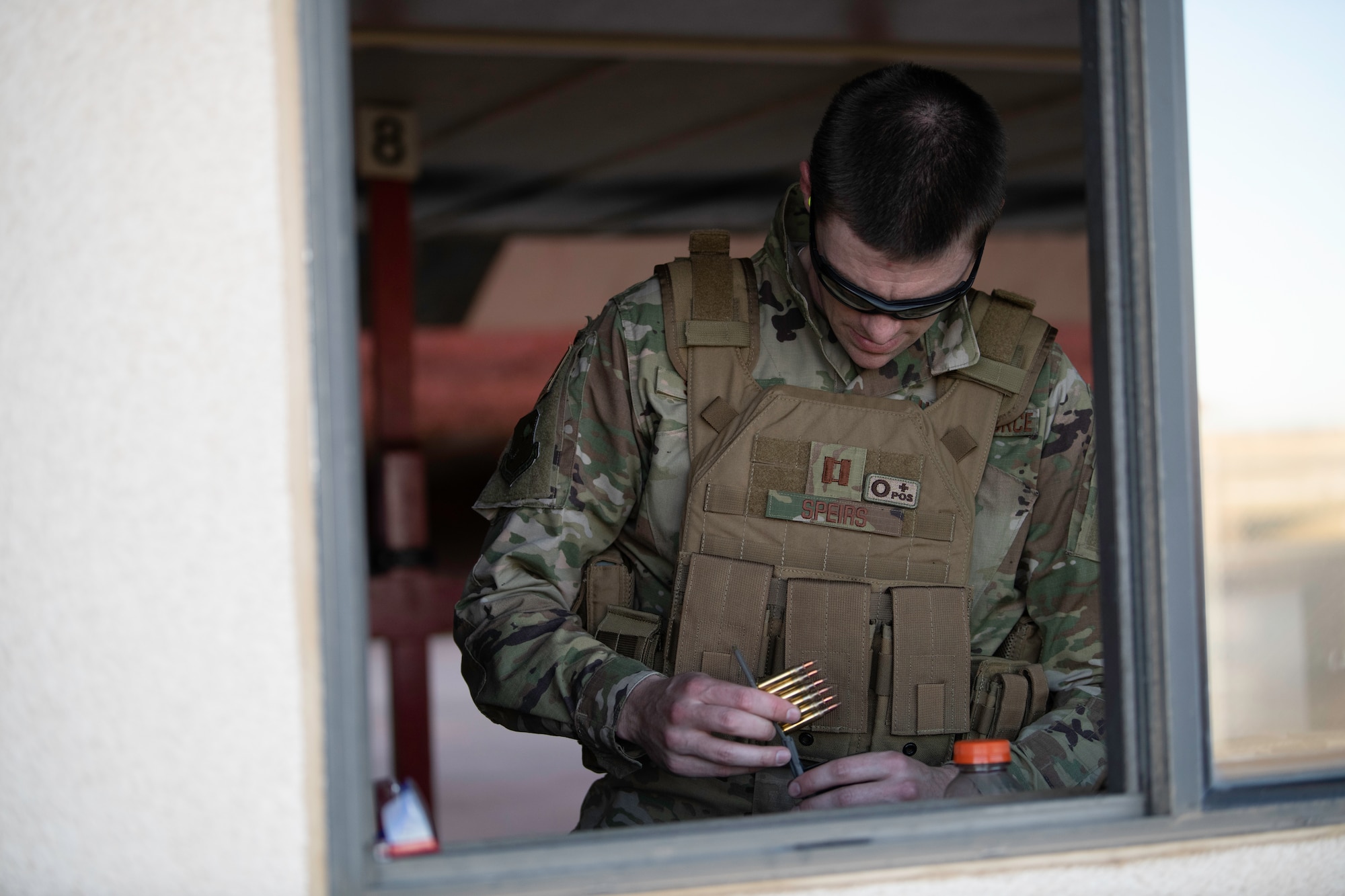U.S. Air Force Capt. Gregory Speirs, 621st Contingency Response Wing judge advocate, loads 5.56 mm frangible rounds into a magazine at Travis Air Force Base, California, May 27, 2020. Speirs participated in an M-4 Rifle/Carbine Air Force qualification course at the 60th Security Forces Squadron combat arms training and maintenance range. The CATM section trains Airmen on 10 weapon systems. (U.S. Air Force photo by Tech. Sgt. James Hodgman)