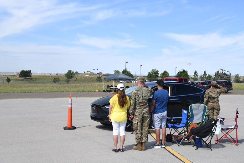 spectators watching skydivers