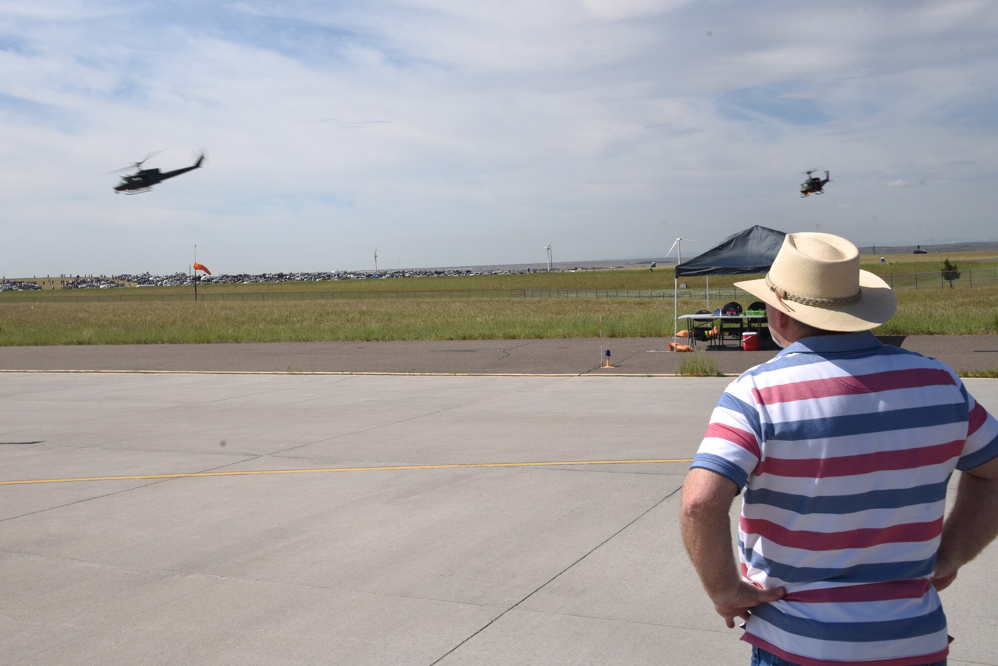 spectators watch helicopters