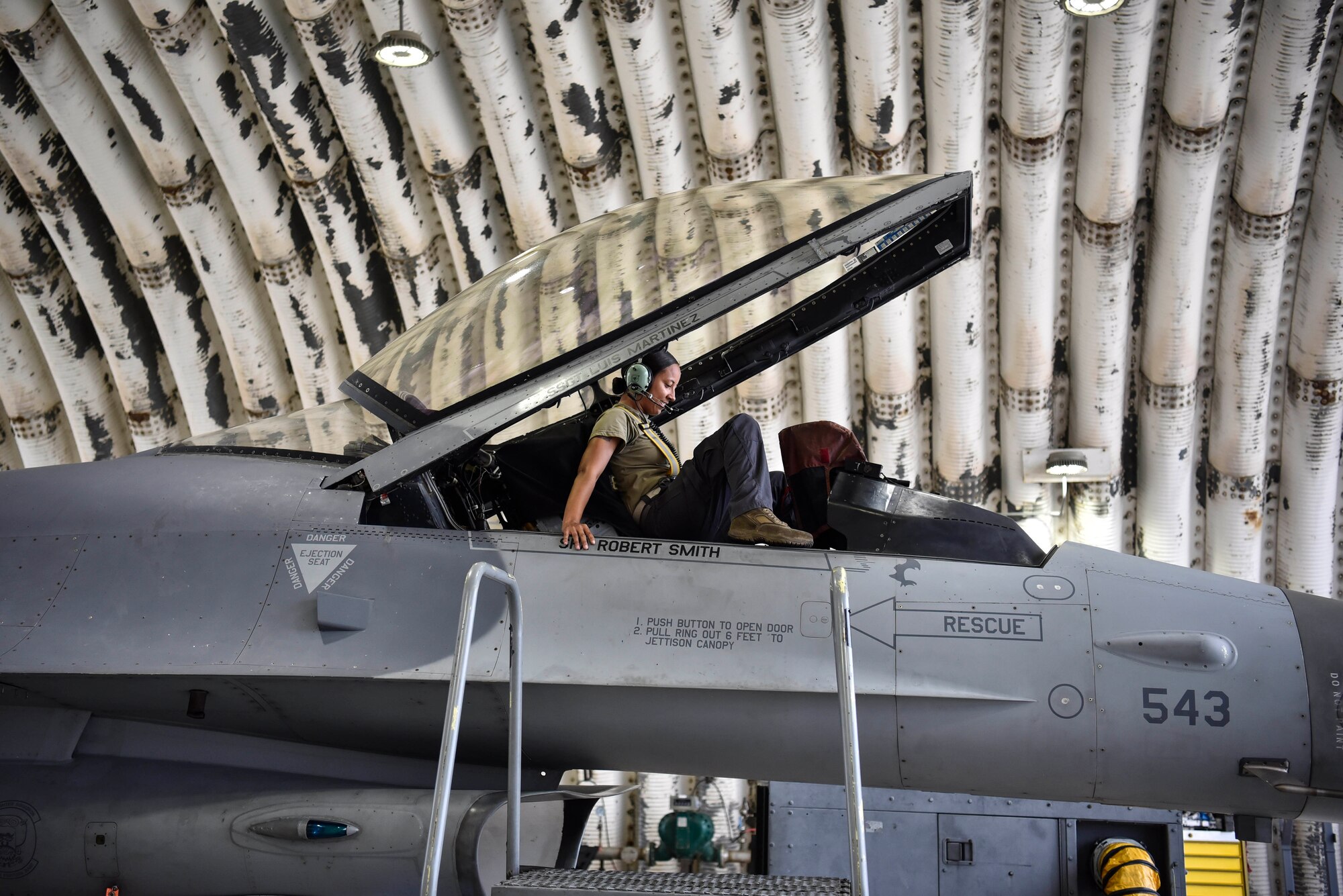 A photo of an Airman performing maintenance on aircraft.