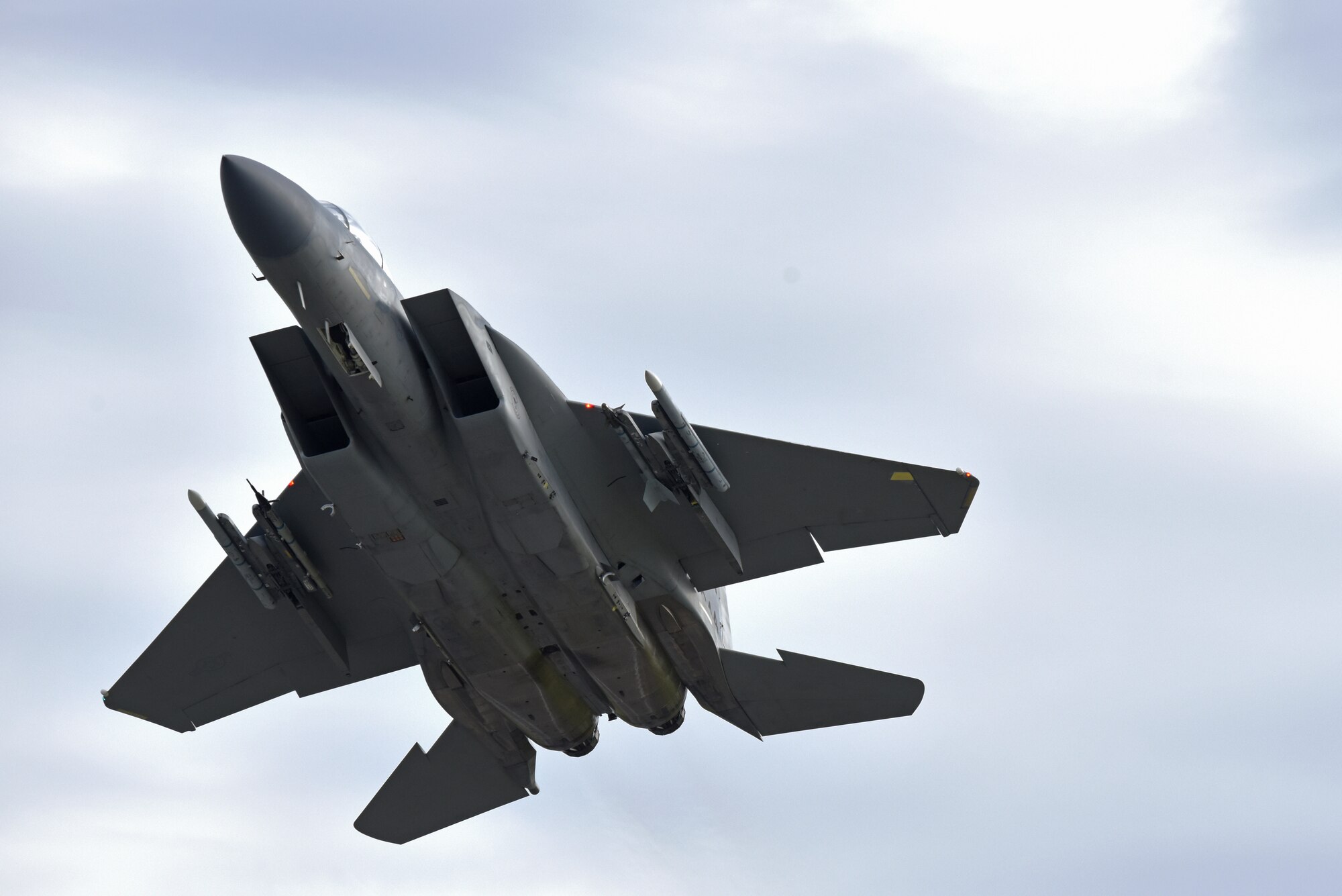 An F-15C Eagle assigned to the 493rd Fighter Squadron flies over Royal Air Force Lakenheath, England, July 23, 2020. To maintain proficiency, Liberty Wing aircrew perform daily training missions ensuring they are always ready to provide worldwide responsive combat airpower. (U.S. Air Force photo by Airman 1st Class Rhonda Smith)