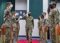 200723-N-KZ419-1005 NAVAL SUPPORT ACTIVITY BAHRAIN (July 23, 2020) –Capt. James Johnston, commodore of Commander, Task Force (CTF) 57 salutes while passing sideboys after a change of command ceremony for CTF 57 on Naval Support Activity Bahrain. The 5th Fleet area of operations encompasses about 2.5 million square miles of water area and includes the Arabian Gulf, Gulf of Oman, Red Sea and parts of the Indian Ocean. The expanse is comprised of 20 countries and includes three chokepoints, critical to the free flow of global commerce. (U.S. Navy photo by Mass Communication Specialist 3rd Class Dawson Roth)