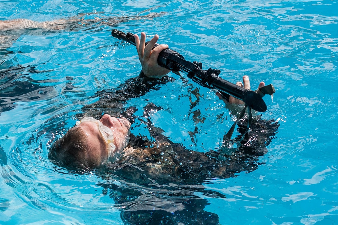 a U.S. Marine participates in a water survival screening at Camp Shelby, Miss., July 19.