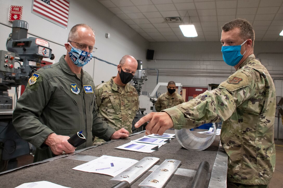 Men around work table