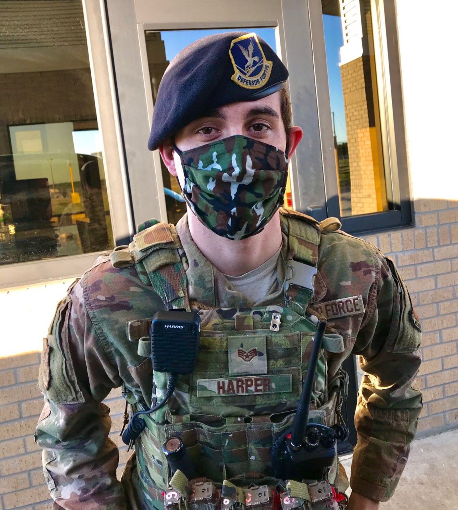 Staff Sgt. Justin Harper, 186th Security Forces Squadron journeyman, works security at the front gate while wearing a hand-made face mask at Key Field Air National Guard Base, Meridian, Mississippi, May 6, 2020.