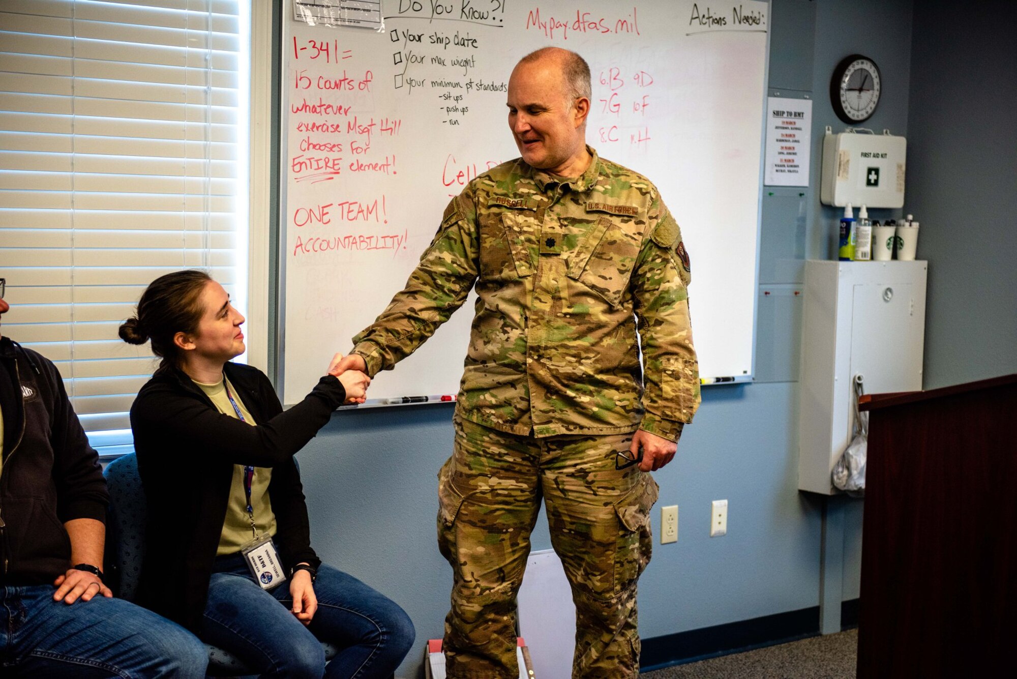 From left, BreAnna Sewell, 919th Special Operations Wing Development and Training Flight student, shakes hands with Lt. Col. Greg Russell, 919th Special Operations Medical Squadron optometrist at Duke Field, Florida, March 7, 2020. (U.S. Air Force photo by Senior Airman Dylan Gentile)