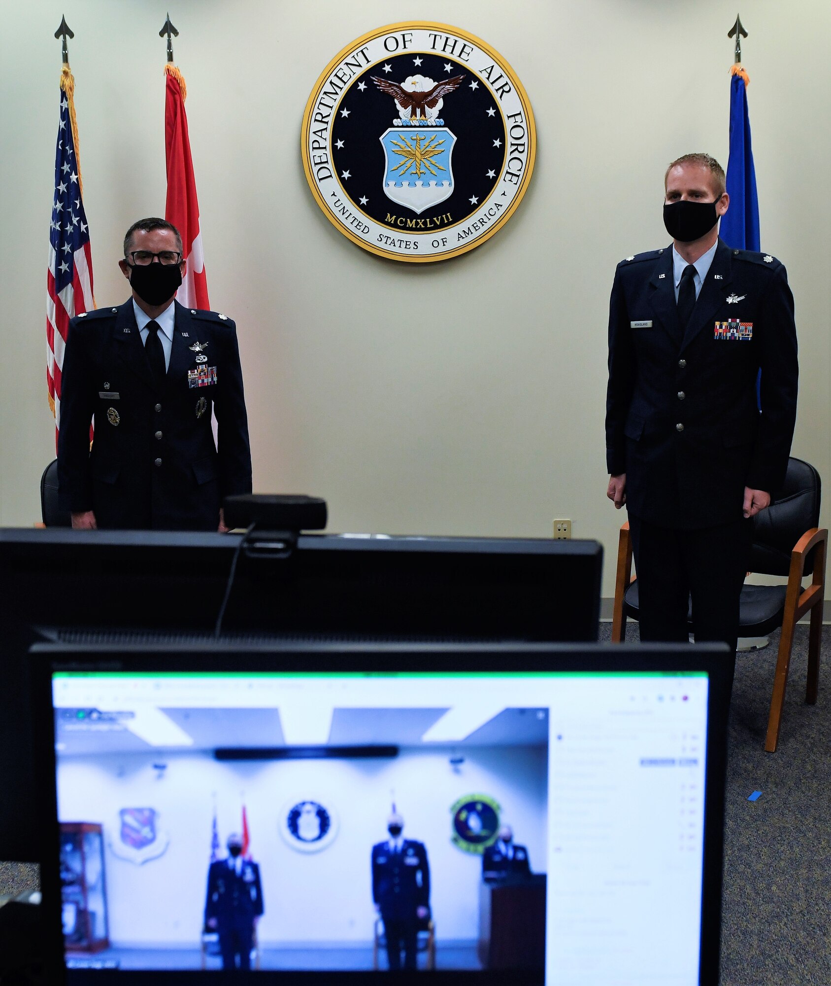 Lt. Col. Blake Hoagland, right, accepted command of the 7th Space Warning Squadron July 10, 2020, during a virtual ceremony at Beale Air Force Base, Calif. Col. Mathew Cantore, 21st Operations Group commander, presided virtually and Lt. Col. Charles Sandusky, left, was the out-going commander. (Courtesy photo)