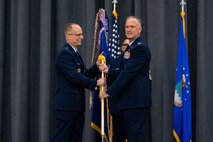 Col. Michael A. Miller, right, outgoing 2nd Bomb Wing commander, relinquishes the guidon to Maj. Gen. Mark E. Weatherington, left, 8th Air Force and Joint-Global Strike Operations Center commander, during a change of command ceremony at Barksdale Air Force Base, La., July 23, 2020. The passing of a squadron’s guidon symbolizes a transfer of command. (U.S. Air Force photo by Airman 1st Class Jacob B. Wrightsman)