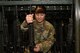 A photo of an Airman grabbing a weapon.