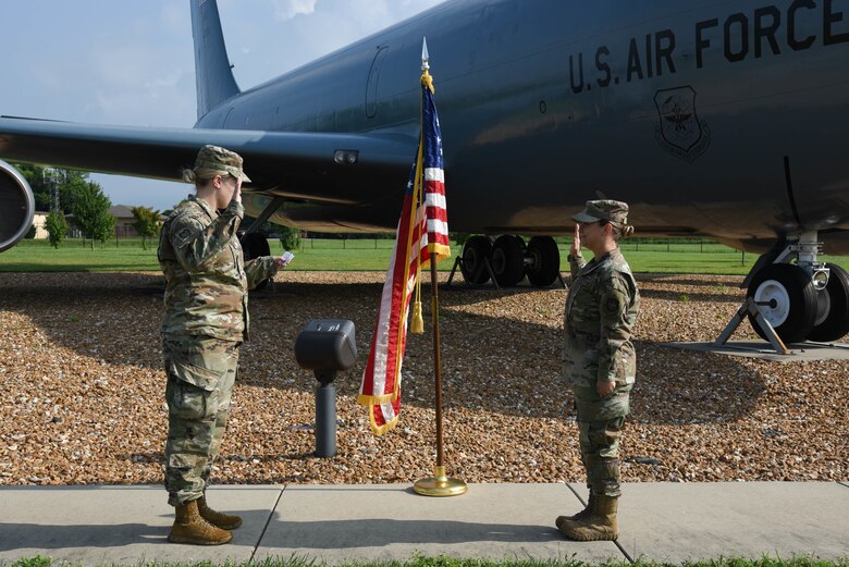 Capt Morgan Bielecki re-enlisting Staff Sgt. Taylor Ray.