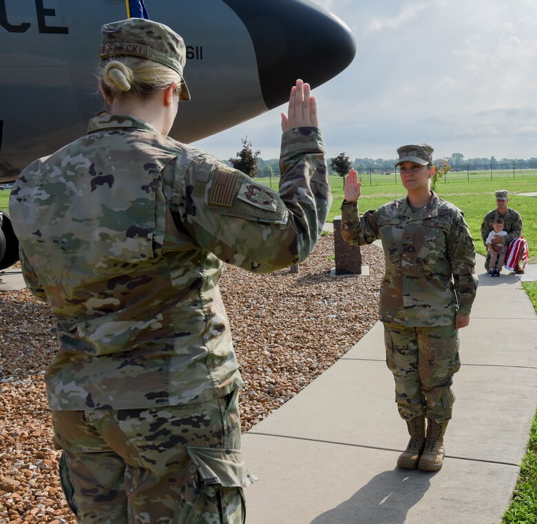 Capt Morgan Bielecki re-enlisting Staff Sgt. Taylor Ray.