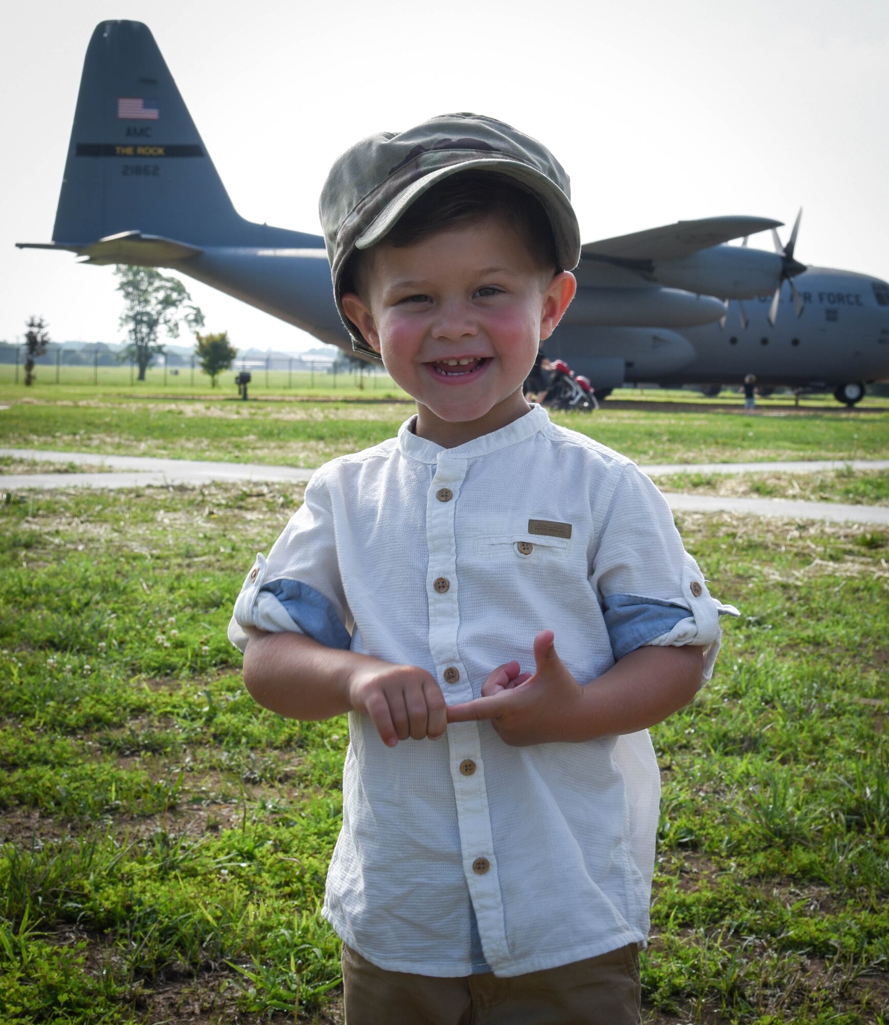 Liam Ray poses with his dad's cover.