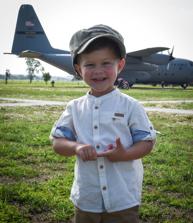 Liam Ray poses with his dad's cover.