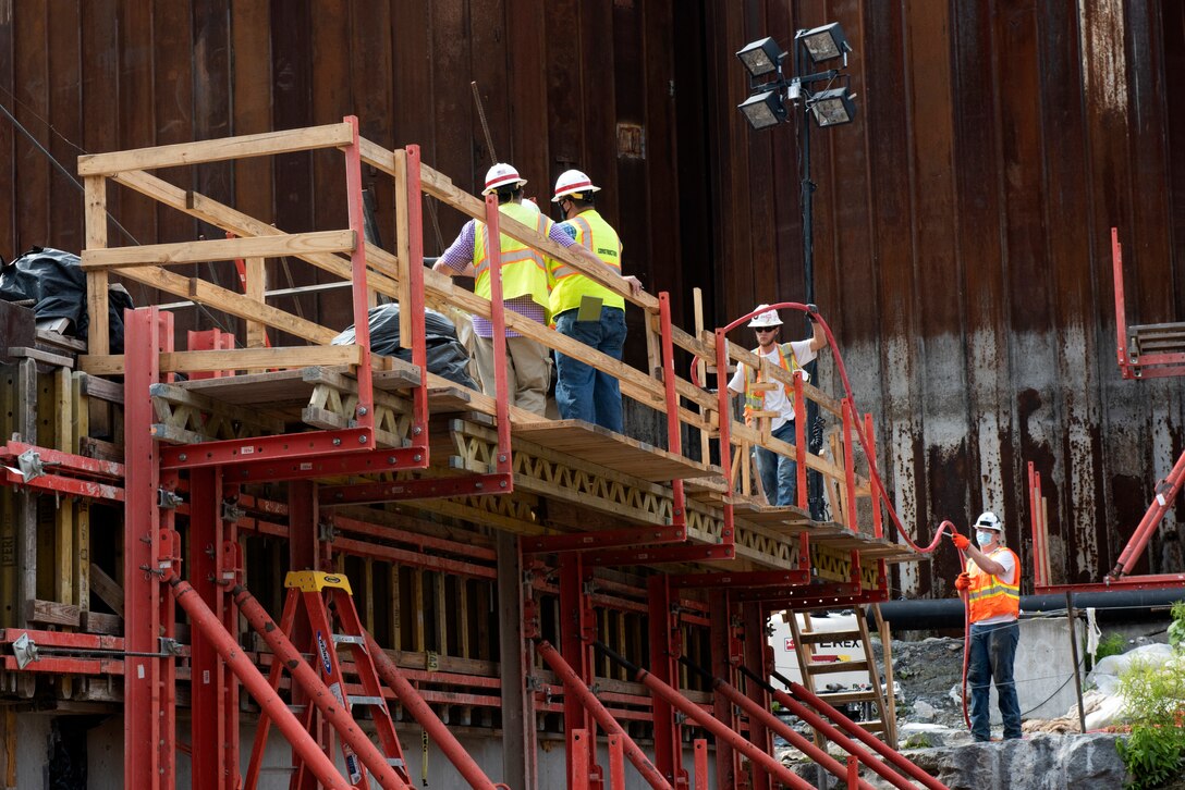 Corps construction representatives oversee Shimmick contractors preparing to drill holes July 21, 2020 to install reinforcing steel in preparation to place more concrete for a monolith. The U.S. Army Corps of Engineers Nashville District is constructing a new navigation lock as part of the Chickamauga Lock Replacement Project at the Tennessee Valley Authority project on the Tennessee River in Chattanooga, Tennessee. (USACE Photo by Lee Roberts)