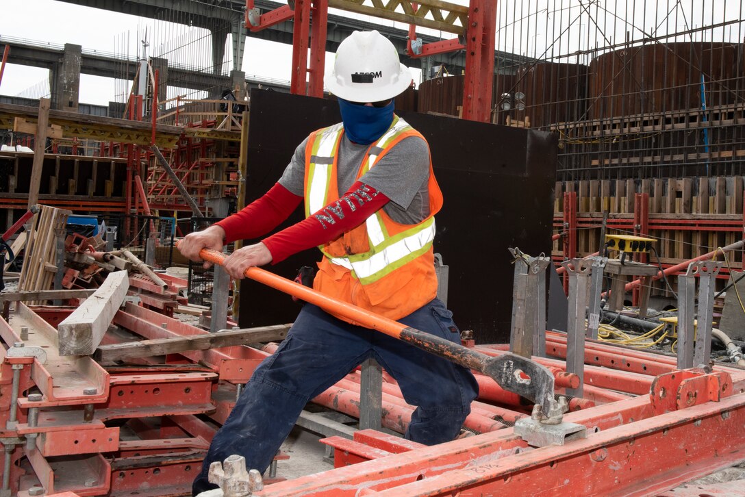 A Shimmick construction worker prepares steel forms July 21, 2020 in preparation to place more concrete for a monolith. The U.S. Army Corps of Engineers Nashville District is constructing a new navigation lock as part of the Chickamauga Lock Replacement Project at the Tennessee Valley Authority project on the Tennessee River in Chattanooga, Tennessee. (USACE Photo by Lee Roberts)