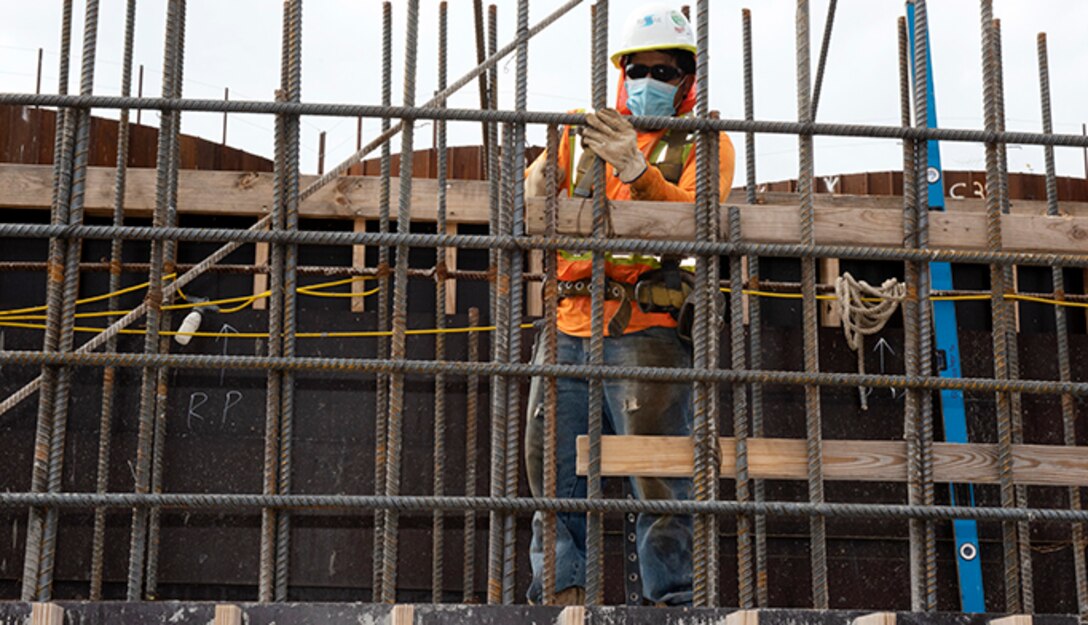 A Shimmick construction worker installs reinforcing steel July 21, 2020 in preparation to place more concrete for a monolith. The U.S. Army Corps of Engineers Nashville District is constructing a new navigation lock as part of the Chickamauga Lock Replacement Project at the Tennessee Valley Authority project on the Tennessee River in Chattanooga, Tennessee. (USACE Photo by Lee Roberts)