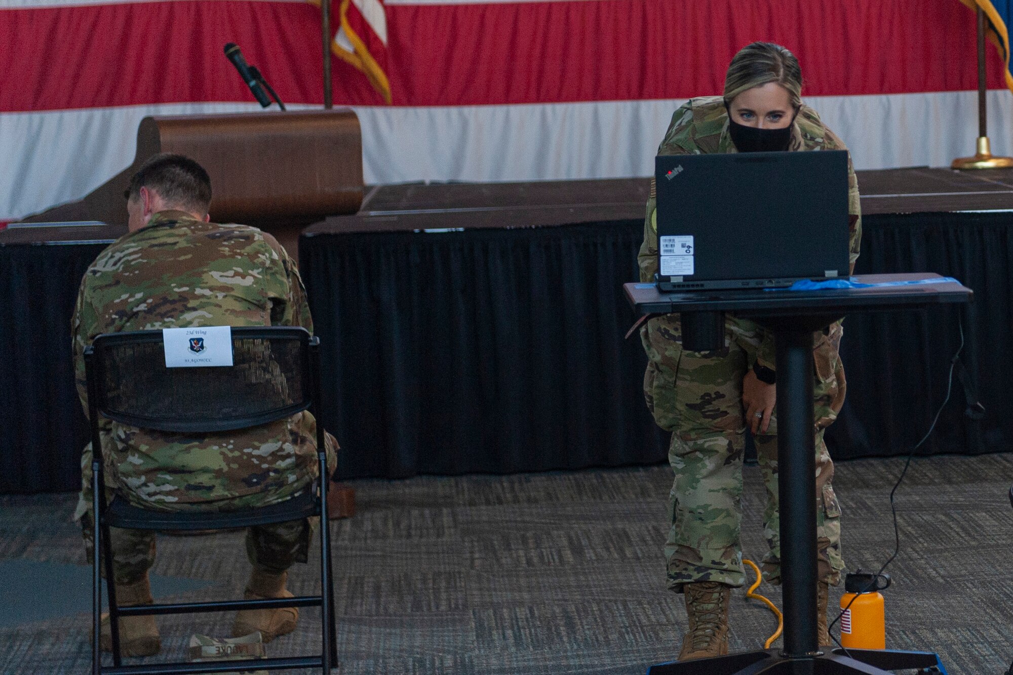Photo of an Airman setting up a computer