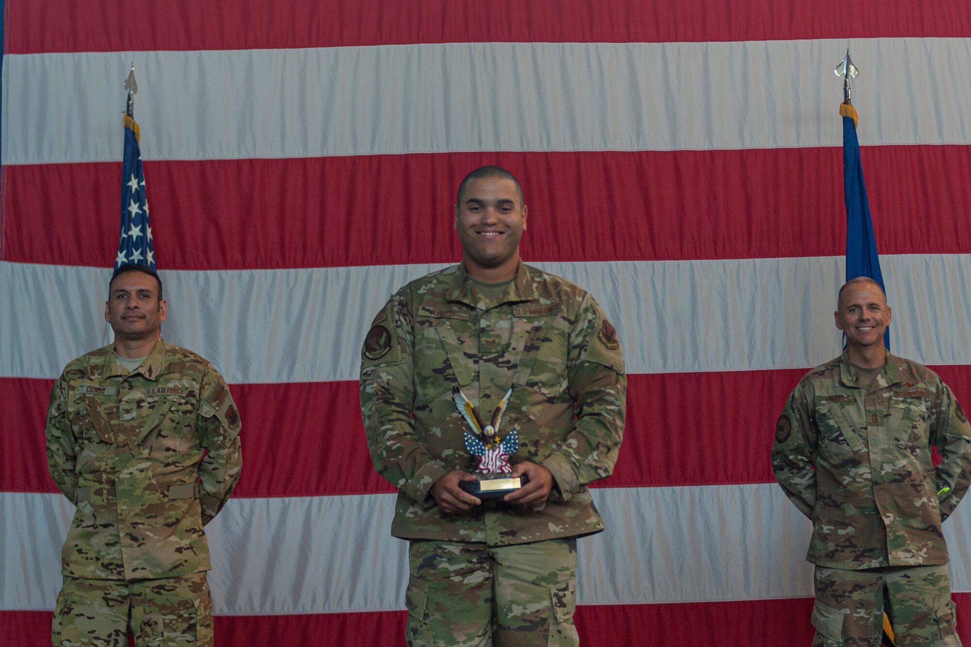 Photo of an Airman receiving an award